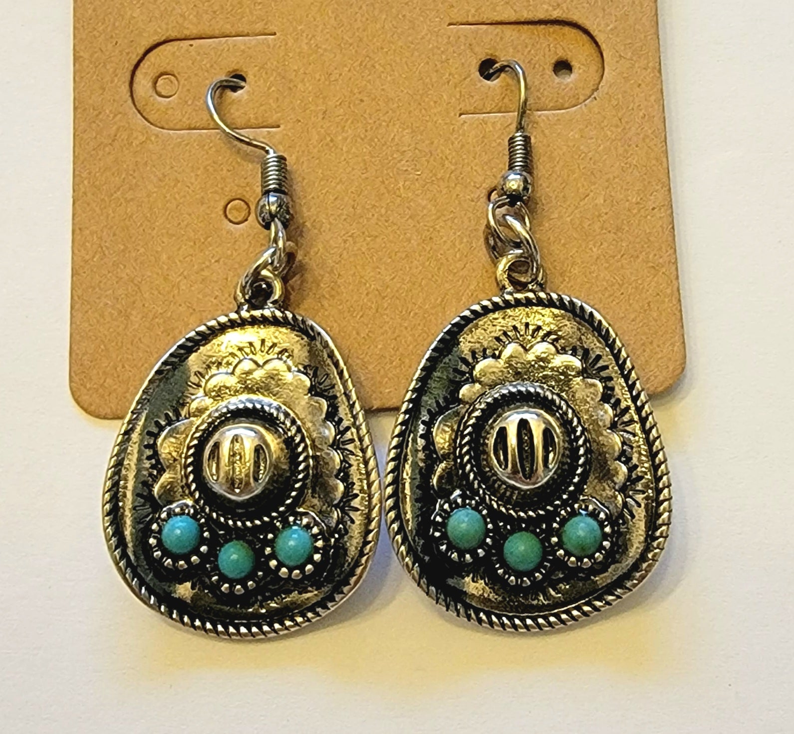 Silver Cowboy Hat with Turquoise Earrings