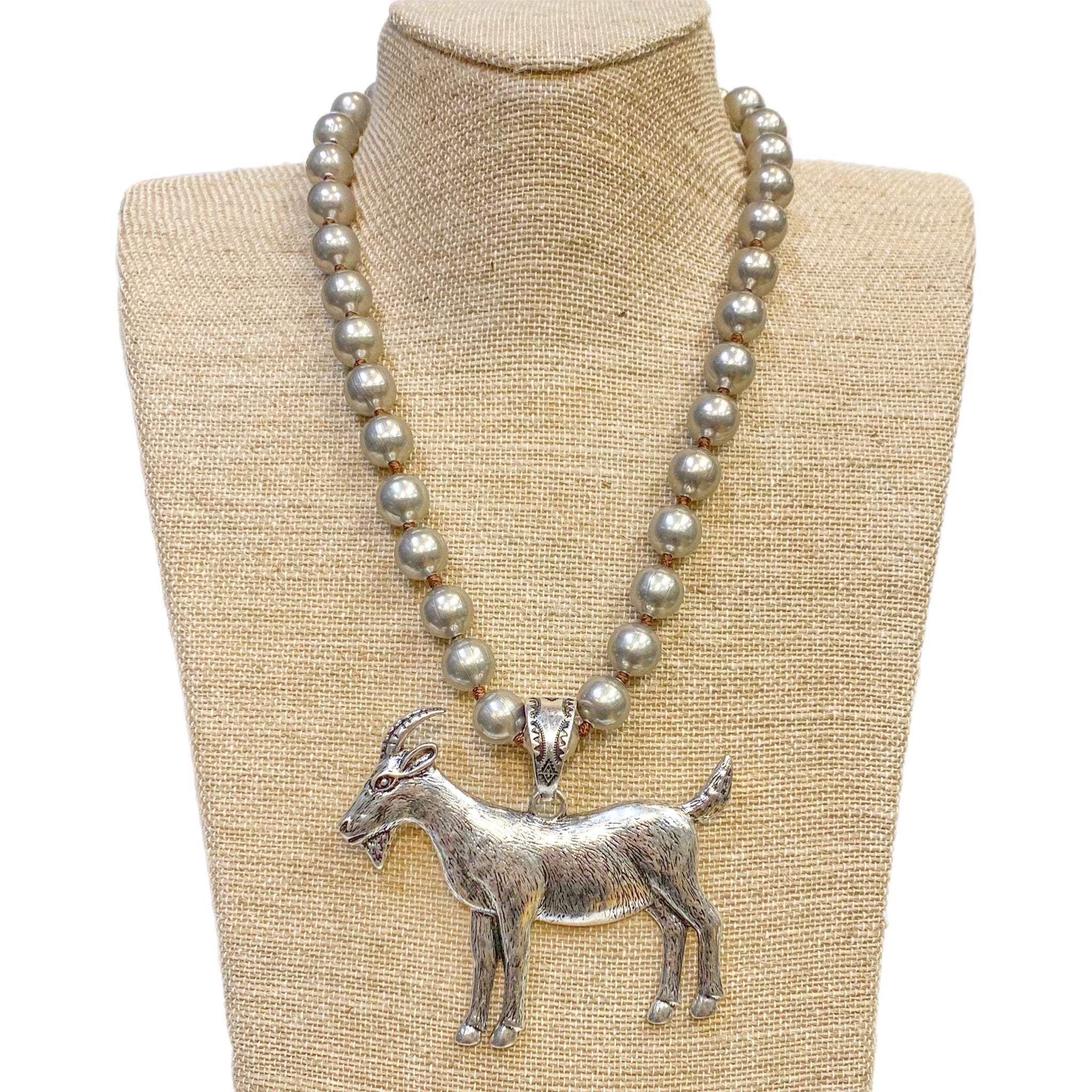 Silver Metal Goat Pendant on a Faux Navajo Pearl Necklace